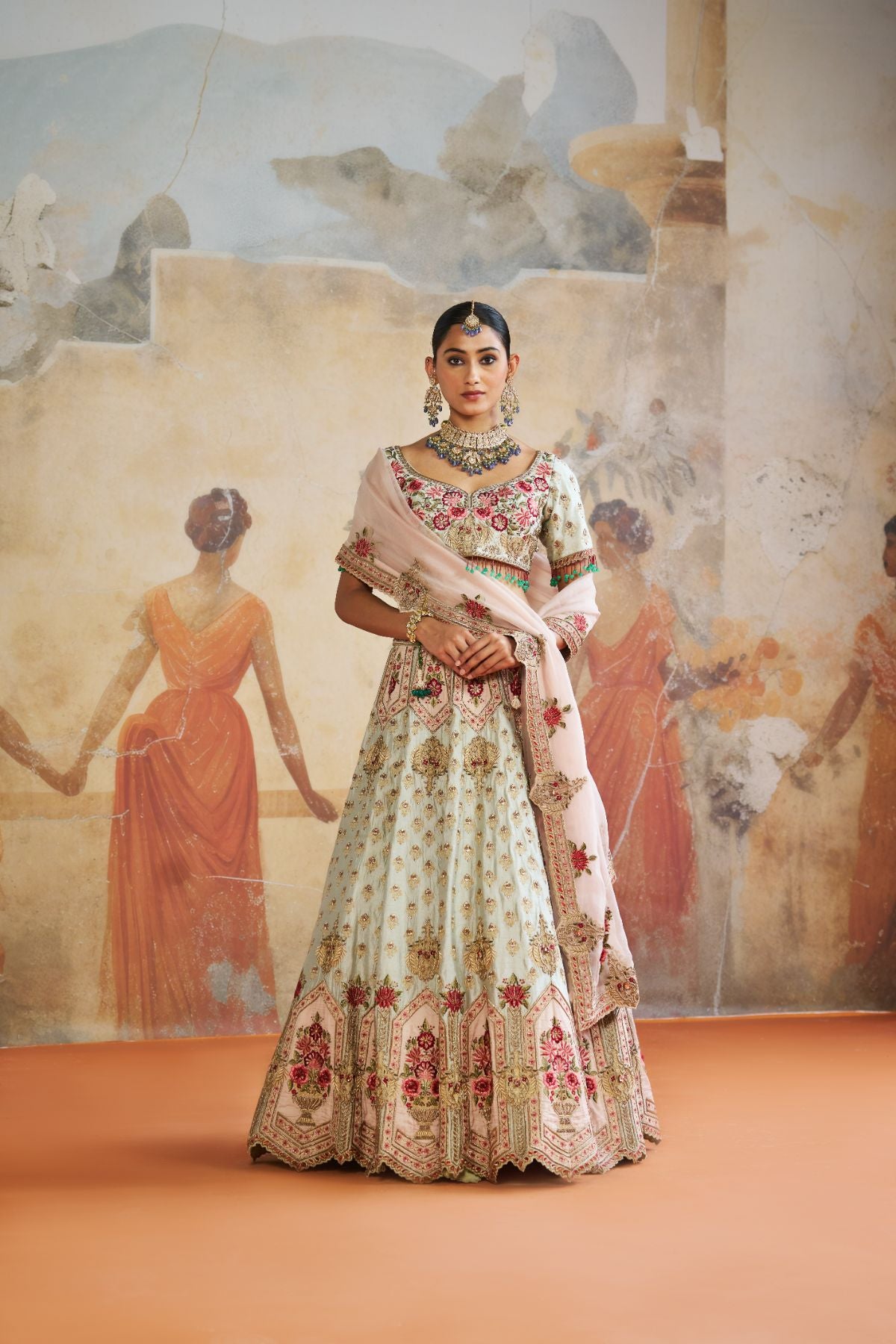 Green zardozi lehenga set.