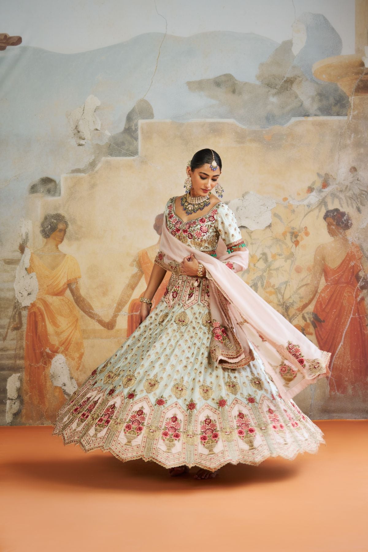 Green zardozi lehenga set.