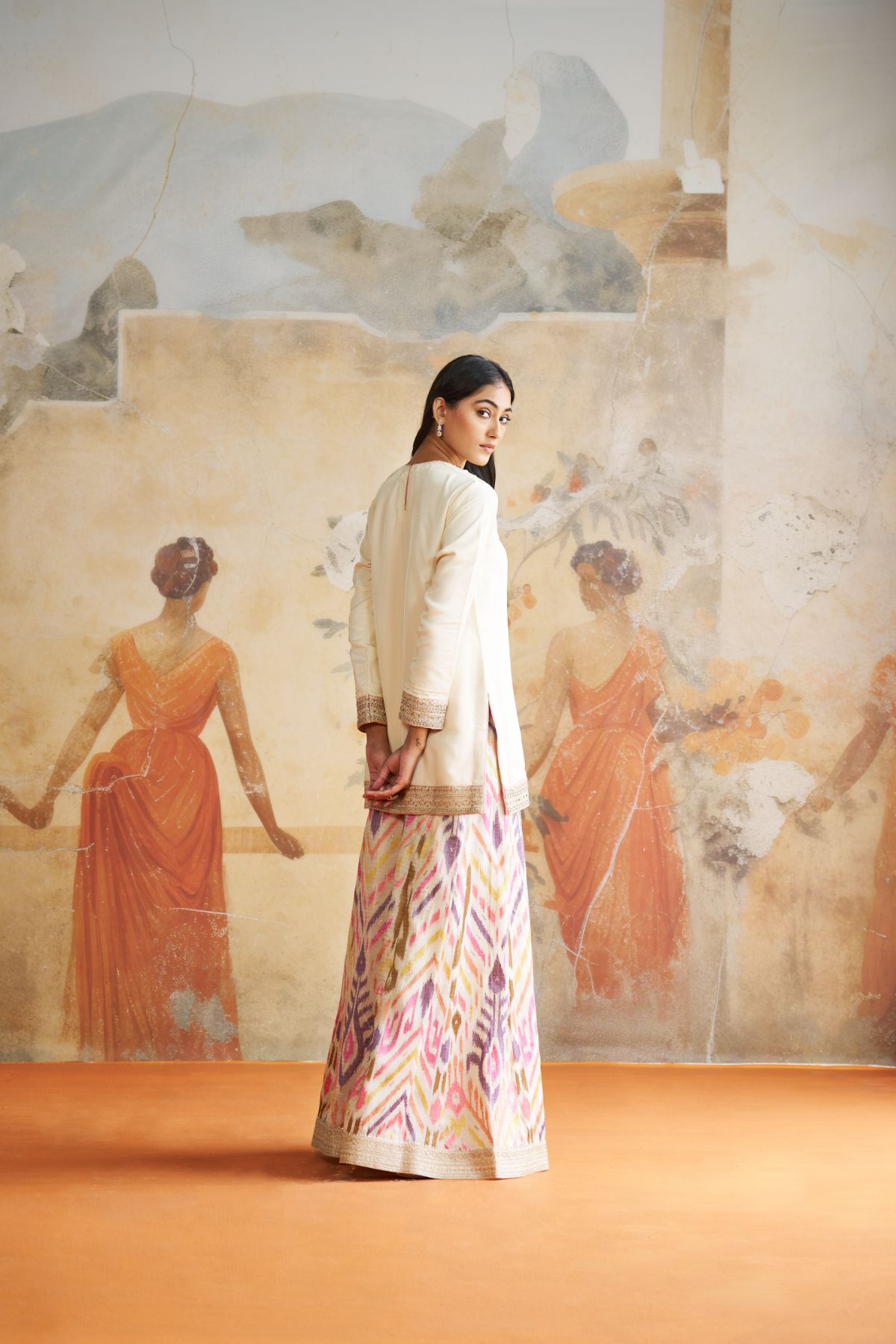 Jeweled short kurta set in peach stones.