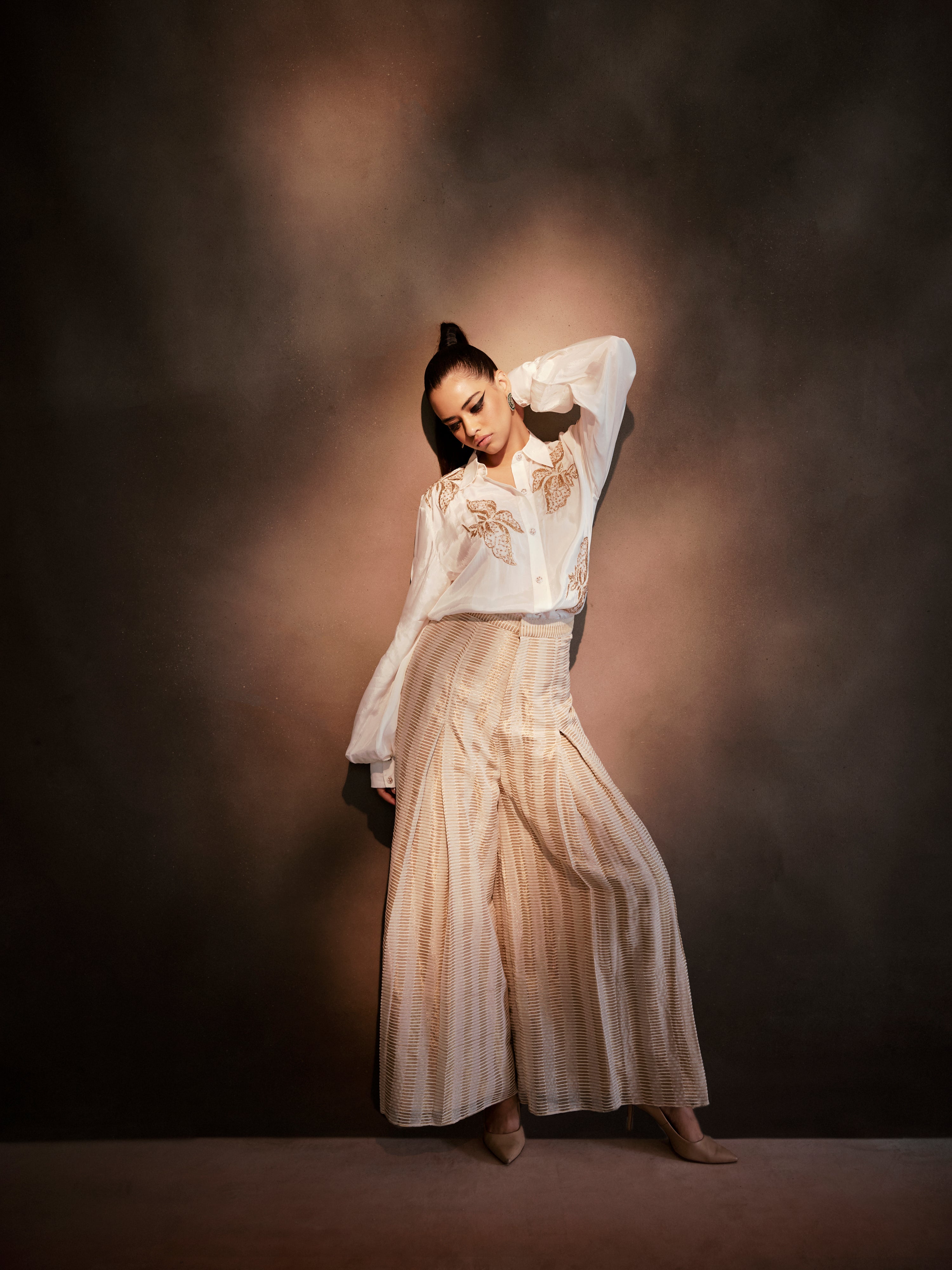 White silk shirt paired with Banarasi weave Pants