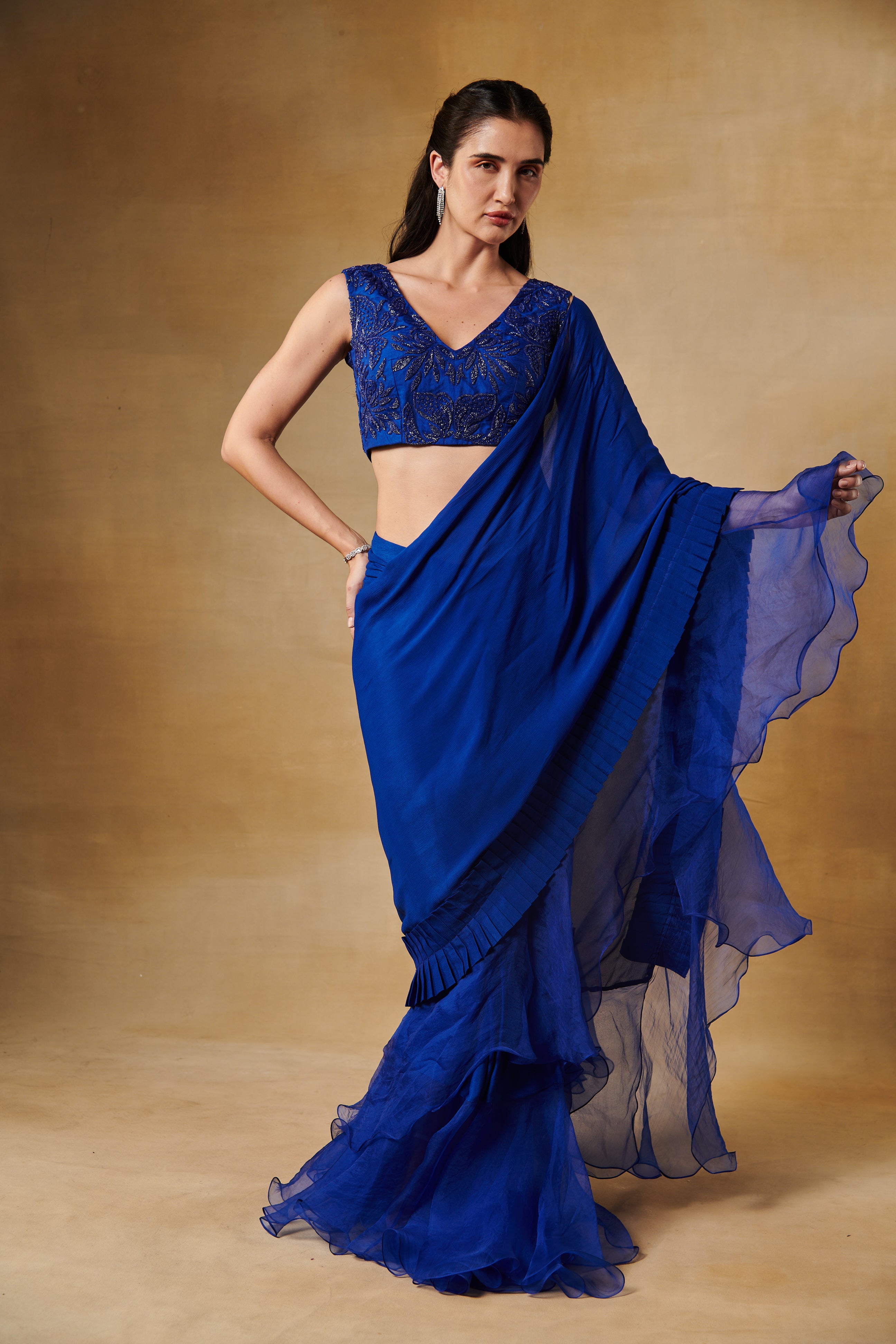 Electric blue beaded blouse with a pleated border saree