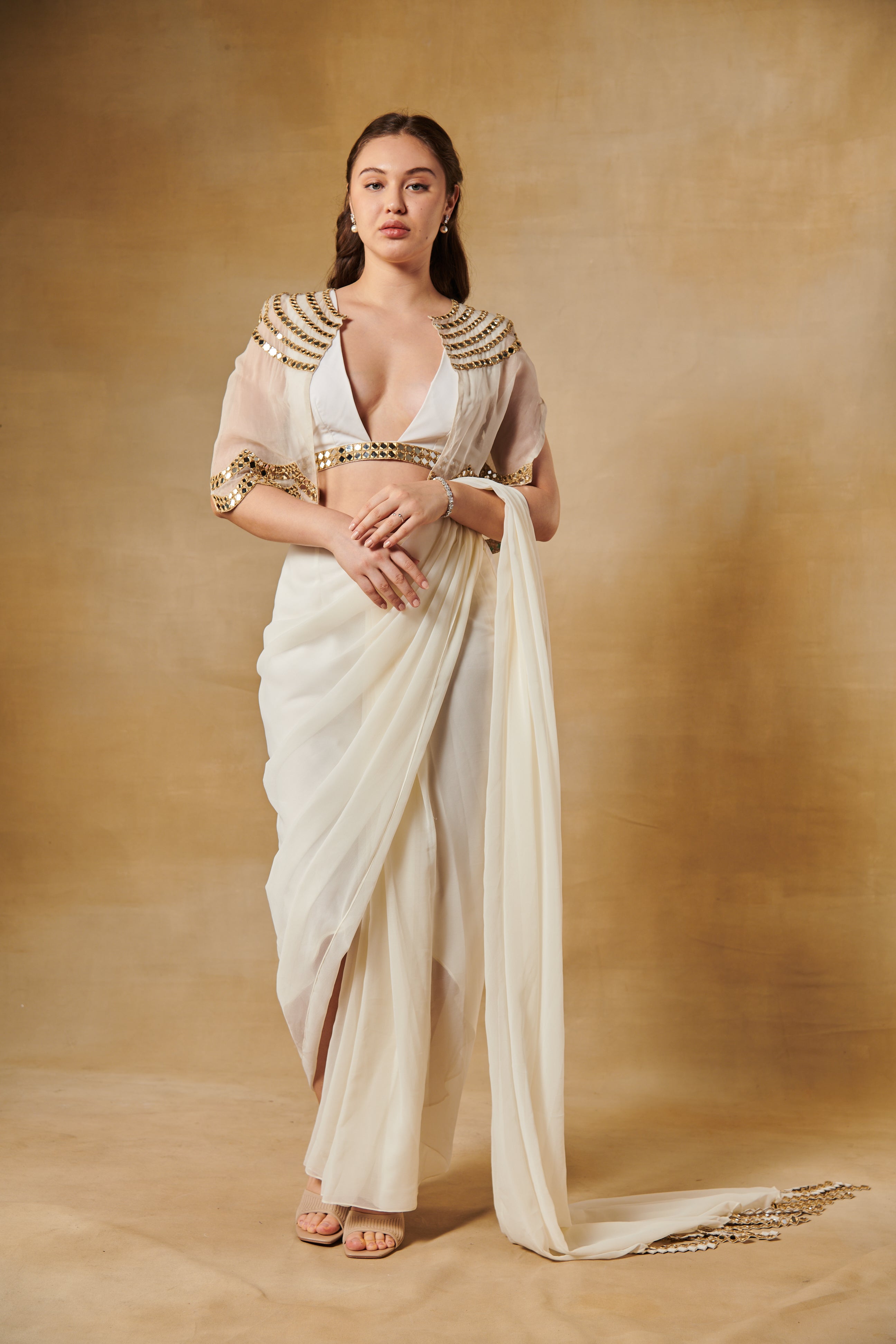 Shell white pre draped saree set layered with mirror work cape.