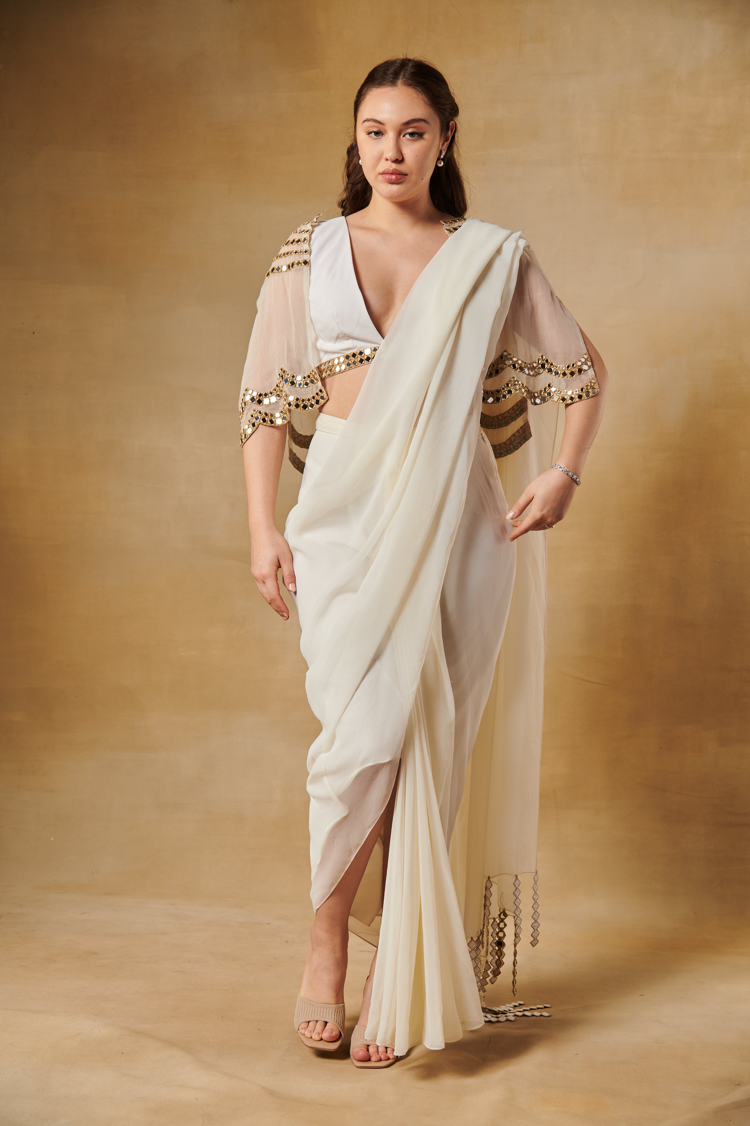 Shell white pre draped saree set layered with mirror work cape.