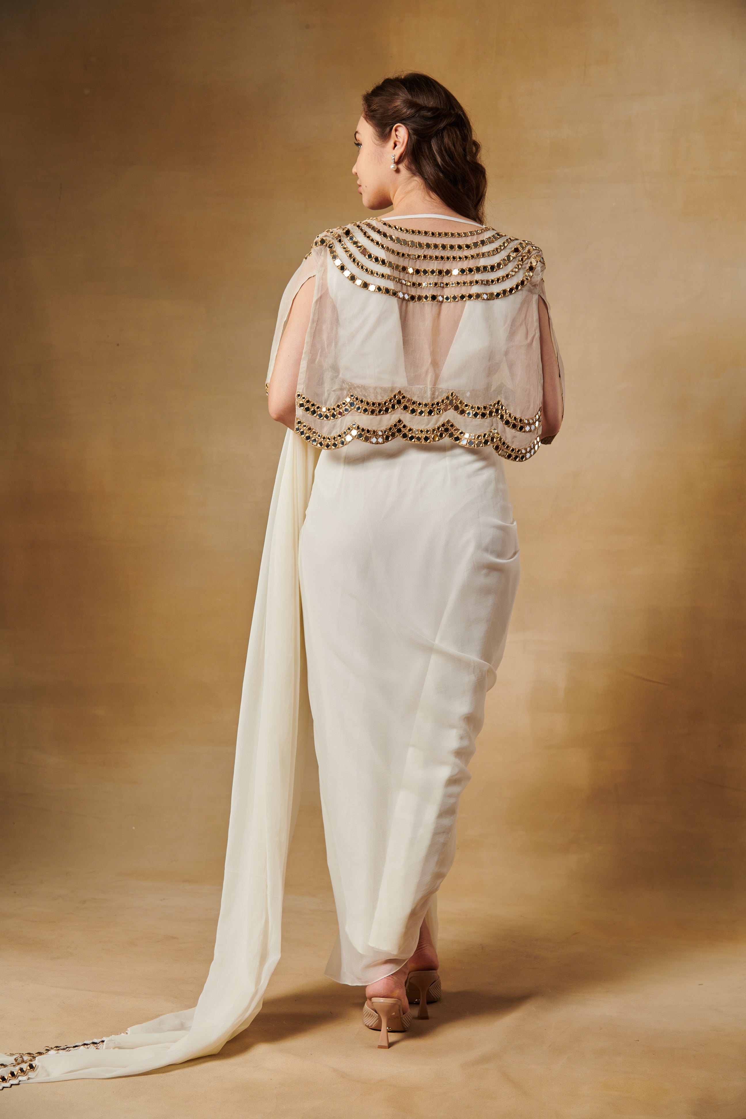 Shell white pre draped saree set layered with mirror work cape.