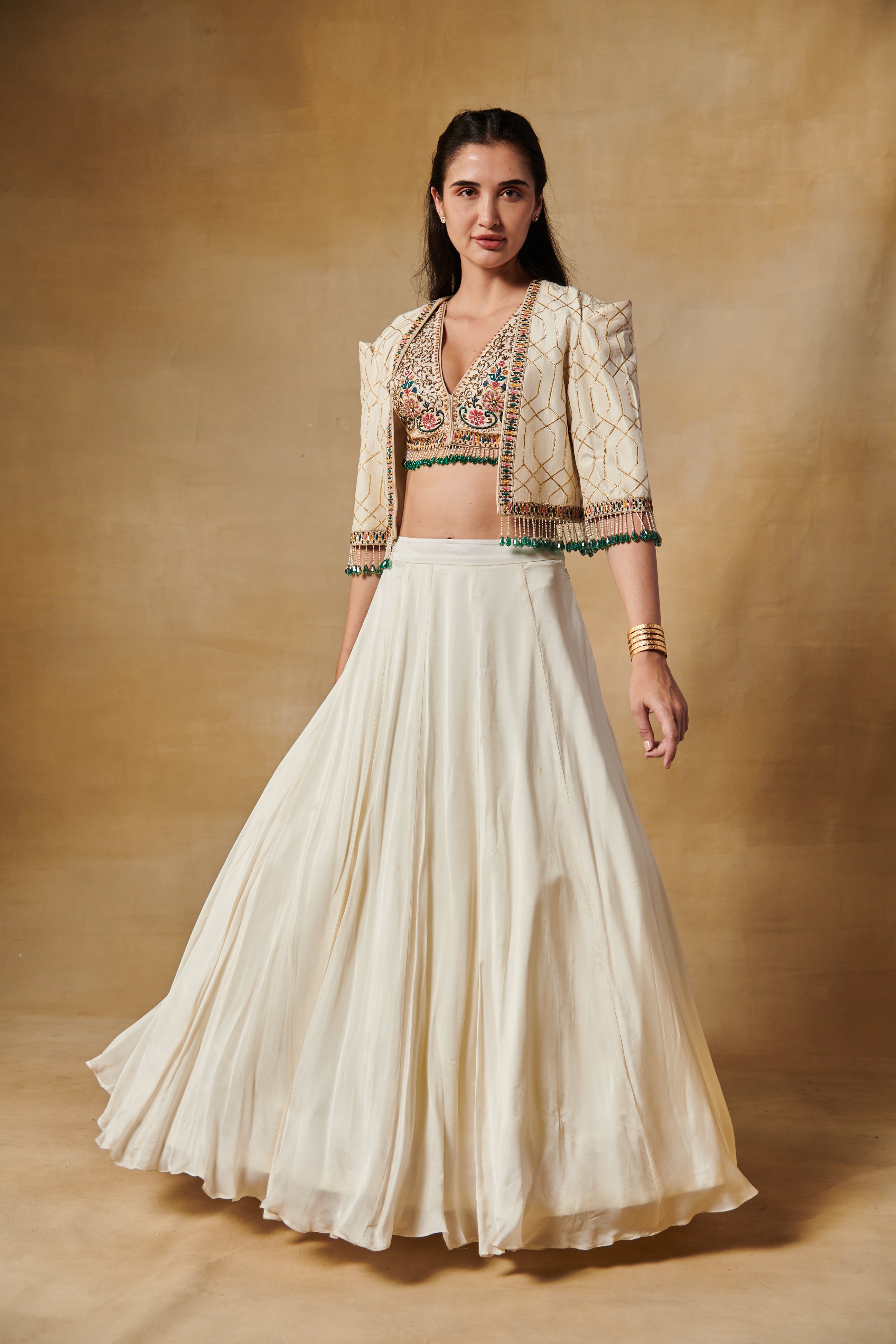 Ivory lehenga set with multi thread embroidery blouse